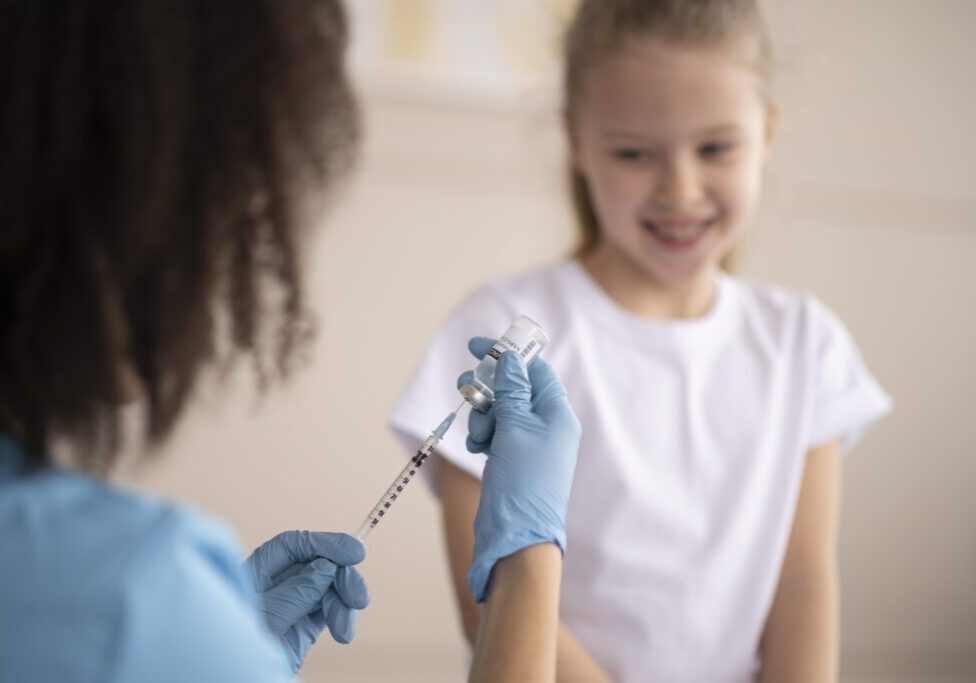 young-doctor-vaccinating-little-girl